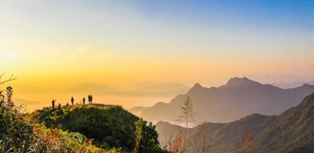 photo of people standing on top of mountain near grasses 733162.jpg